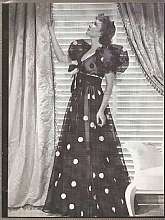 Vintage Media Image of Claudette Colbert in a gown designed by Travis Batten for