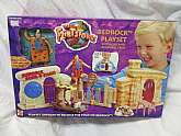 The Flintstones Bedrock Playset with Car, Complete town and Bendable Fred and Accessories. Playset unfolds to become the town of bedrock! Bend & pose Fred anyway you like! New old stock, but factory box will not be in perfect condition. Box never open