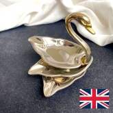 It's a lovely Swan shaped, silver plated ashtray set in 3 piece by Seba, England from 60's.