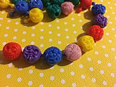 Fun retro monster pop beads that look like Madballs. 