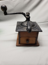 This charming antique cast iron & wood grinder is original; not a reproduction. It is in excellent condition for it's age. Perfect compliment for farmhouse décor. A true antique worth collecting.