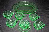 Up for sale are these Diamond Glass Company Victory Green Depression Glass Set 8 pieces in excellent condition with no chips or cracks. The Platter measures approx.12 1/4"L by 8 1/4"W. There are also 6 cups and one saucer. Made between 1929-1932