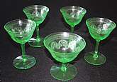 Up for sale are these Tiffin Franciscan Green 14196-11 Set Of 5 Depression Glass Stemware Pieces in excellent condition with no chips or cracks. Included are Four 4 1/4" T by 2 7/8" W glasses and One 3 1/2" T by 3 3/4" W glass.Shippi