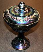 Up for sale is this Blue Iridescent Carnival Glass Covered Compote. The compote measures approx. 10 1/4 " Tall by 6 3/4 inches wide and is in excellent condition with no chips or cracks. Shipping Excludes: Alaska/Hawaii, US Protectorates, APO/FPO,