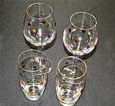 Up for sale are these Pier 1 Color Polka Dot Confetti Set Of Four Glasses in excellent condition with no chips or cracks. The large glasses measure approx. 10 1/8"T by 3"W and the two tumblers are 7"T by 3 1/4"W. Shipping Excludes: A