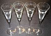 Up for sale are these Love Bird Set Of Four Champagne Flutes in excellent condition with no chips or cracks. Two different designs. The glasses measure approx. 11 1/4"T by 3 "W.Shipping Excludes: Alaska/Hawaii, US Protectorates, APO/FPO, PO Bo