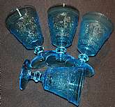 Up for sale are these Four Colony Blue Sandwich Pattern Water Or Iced Tea Glasses in excellent condition with no chips or cracks. The glasses measure approx. 5 5/8"T by 3 3/4"W.  Shipping Excludes: Alaska/Hawaii, US Protectorates, APO/FPO, PO