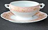 Up for sale is this antique T & V France ( Tressemanes & Vogt) Pink & Gold Floral Gravy Boat With Attached Underplate in great condition with no chips or cracks and minor gold wear. It measures approx. 9 1/2"W.Shipping Excludes: Alaska/