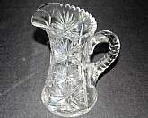 Up for sale is this Vintage Beautiful Large Glass Pitcher in excellent condition with no chips or cracks. It measures approx. 9 1/8"T by 5 1/4"W at the bottom.  Shipping Excludes: Alaska/Hawaii, US Protectorates, APO/FPO, PO BoxShipping Provi