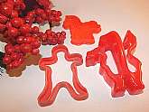 Three (3) red plastic cookie cutters Vintage 1980s baking supply.  Santa Claus, Gingerbread Man, and Pony.
