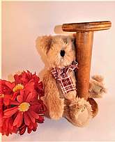 This beige stuffed plush teddy bear sitting with an old wooden bobbin will look adorable in a rustic, primitive or county farmhouse setting.  Or, as a theme decoration in a sewing room!