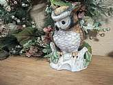 Vintage porcelain owl figurine. Mid-Century art pottery home decor; exquisite hand-painted detail of a bird perched on a tree stump. 
