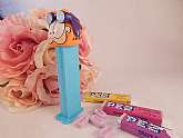 Garfield PEZ candy dispenserComic strip cat wearing purple aviator gogglesCollectible candy holder toyBlue stem with feetVintage 1978Marked "Made in Slovenia" Patent number 4.966.305Measures approximately 4 1/2" h x 1 1/4" w x 1