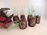 Set of six (6)  green glass cocktail serving glassesTen (10) ounce tumblers -  6 1/2" h x 2" diameterEach glass is cuffed with a tooled leather sleeveGold embossed Manticore image on the front of 3" tall sleevesMarked "Made in Ital