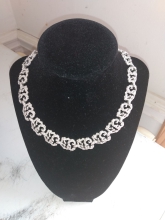 This stunning piece is a hammered silver, in a leaf design. casual or dressed up, it makes a great addition.