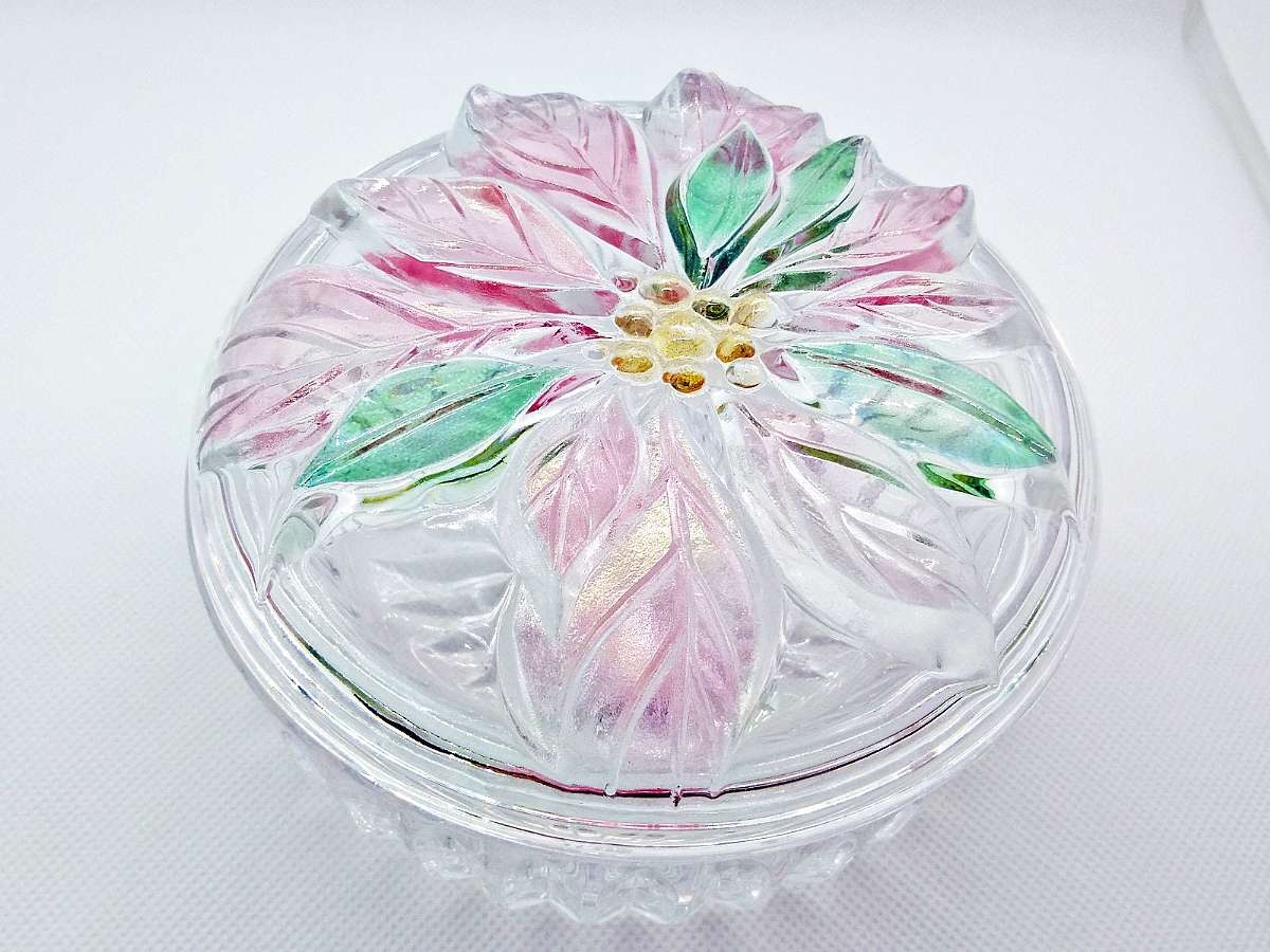 A beautiful vintage Mikasa crystal glass candy dish with an embossed poinsettia flower on the lid in pink, green and gold.From the Mikasa Savoir Vivre Holiday Spirit line.