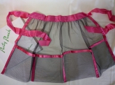 Decorative apron from the 40's made from black nylon tule and pink rayon tie and trim.