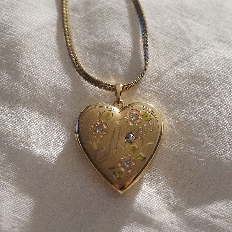 Beautiful vintage gold filled engraved heart diamond locket necklace.