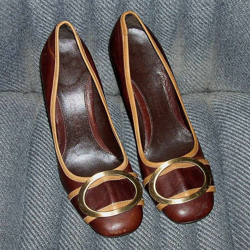 Vintage hardly worn buckle front Jessica Bennett leather high heel pumps in brown with tan contrasting accents.  It is a size 6 and in great condition but could use some brown shoe polish to make the leather more uniform due to some lightening due to wear