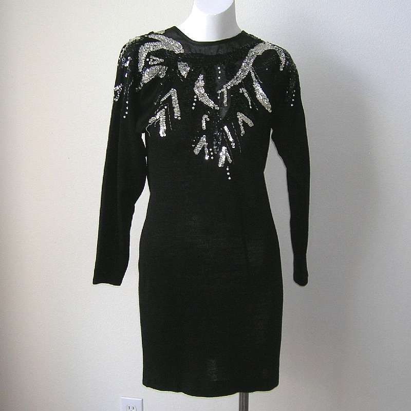Funky vintage 80s rock glam beaded wiggle sweater dress that is so figure flattering. It has a beaded & sequined neckline that includes some sheer organza at the neck that is lovely.  I believe this could be worn either way (reversible).  It is above
