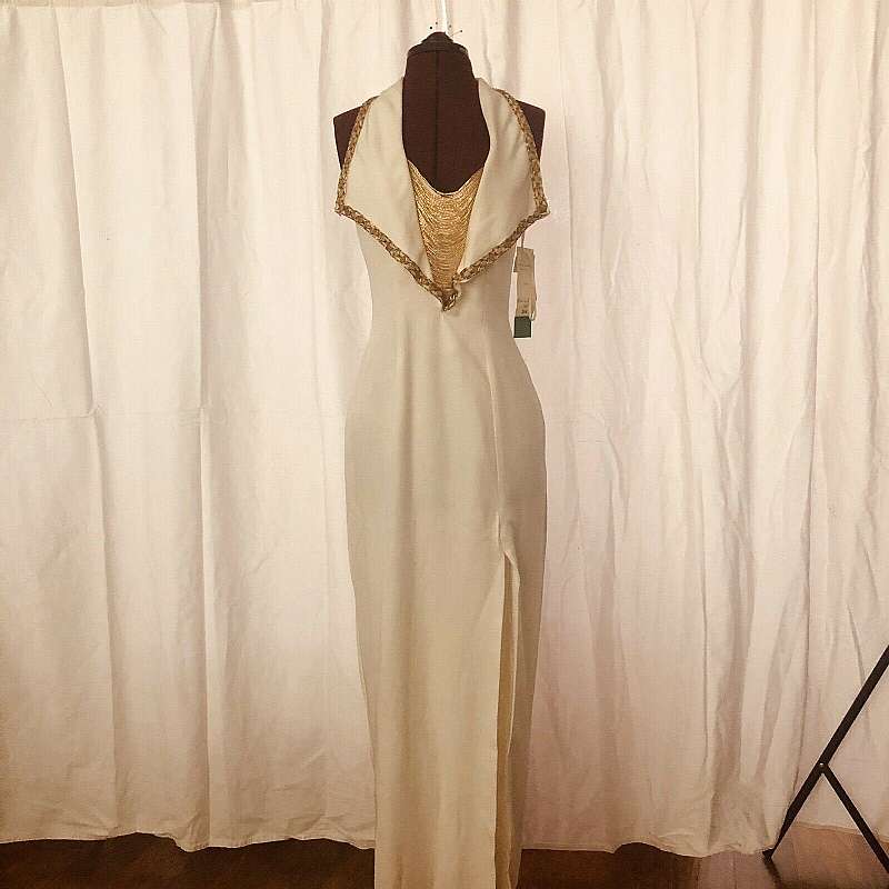 This dress is 2-die-for with it's 80s does Art Deco styled halter with beaded trim and beaded draped decolletage area.  It is sexy and very alluring; sure to turn every head in the room!  The cream and gold combination is classic and classy!  This gown ha