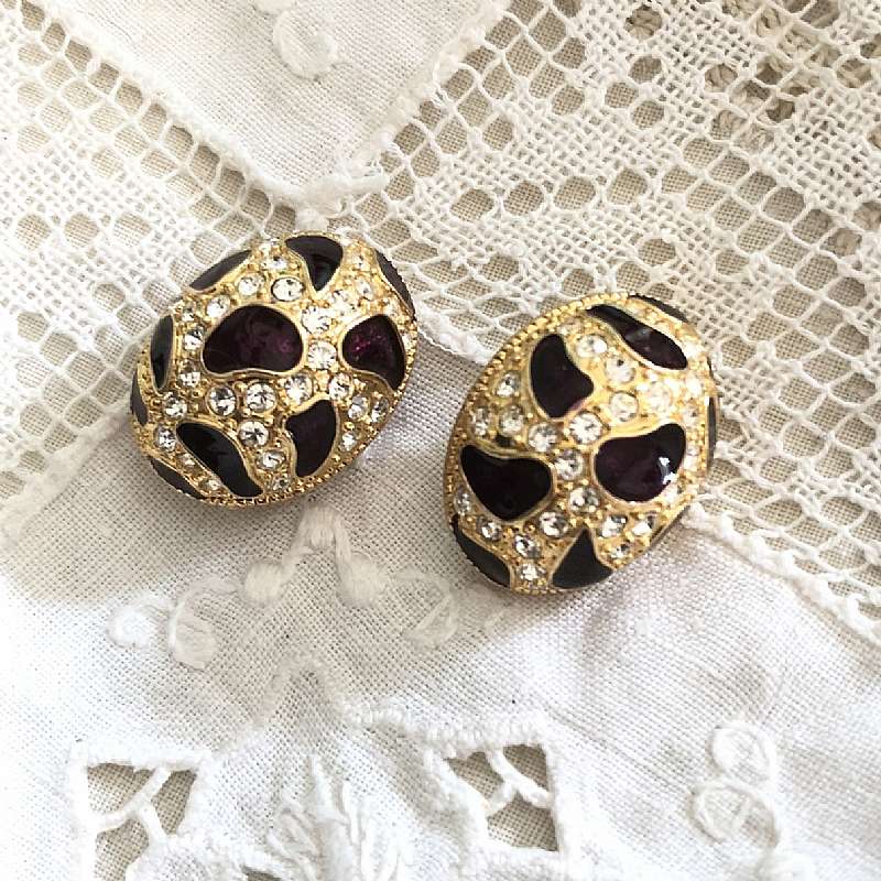 Sweet vintage high dome faux siam ruby and rhinestone statement earrings in goldtone setting. They have pools of Siam ruby enamel that dance in between the rhinestone chatons.   Measures 1 inch and looks amazing on!
