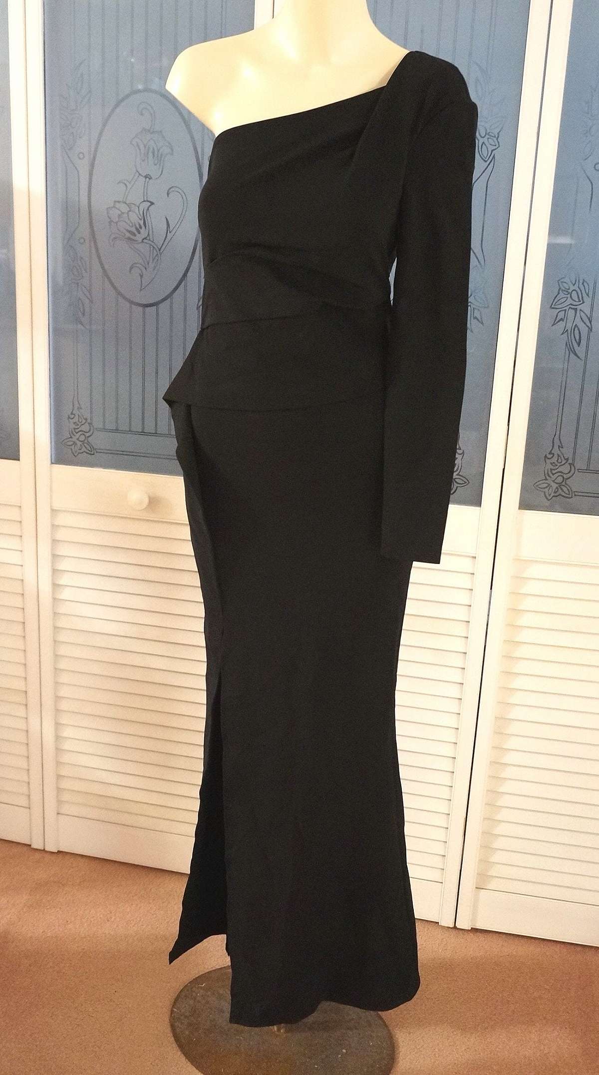 Stunning new old stock with tags Escada one shoulder asymmetrical ruffled origami formal gown dress perfect for the prom, holiday events or red carpet.  It is made from a heavy viscose polyamide elastane that really hugs the body and pulls problem areas i