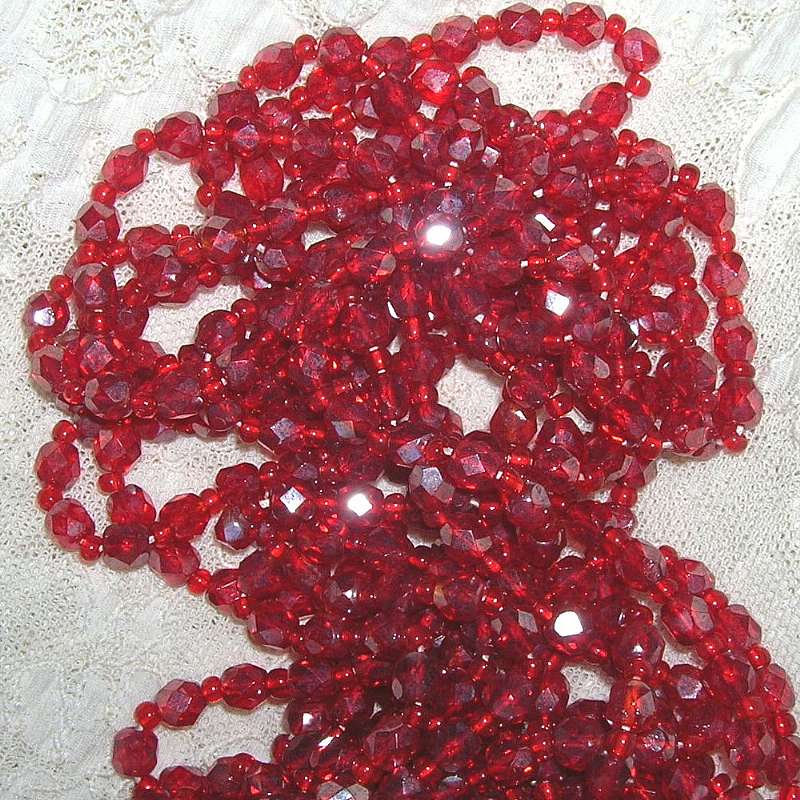 One 16" strand of 1940s 1950s vintage Austrian crystal beads in a medium red color.  They are silver flashed aurora borealis and measure 5.5 mm.  They have smaller red spacer beads between them.  Convo us if you need greater quantities!