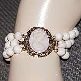 Beautiful vintage 3 row wide angelskin coral cameo clasp bracelet in the palest angelskin coral color.  It measures 1 1/8