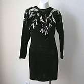 Funky vintage 80s rock glam beaded wiggle sweater dress that is so figure flattering. It has a beaded & sequined neckline that includes some sheer organza at the neck that is lovely.  I believe this could be worn either way (reversible).  It is above