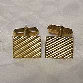 Fabulous vintage gold plated ribbed cuff links by Swank. The cuff links are in great vintage condition and measure 5/8".  We gladly accept reasonable offers on all of our merchandise.