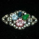 Beautiful vintage 1960s rhinestone lucite fruit salad flower cabochon brooch pin.  The flowers and green cabochon are lucite, the blue cab is glass and there are pave' set rhinestone accents in the background.  It is heavy for its size and very well made.