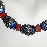 Amazing antique Chinese Mandarin enameled sterling silver reposse' bead and coral bead necklace with fancy twist clasp.  This is absolutely gorgeous in hand with beautifully worked silver reposse acorn or ribbed squash beads. We have tested this and it is