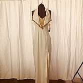 This dress is 2-die-for with it's 80s does Art Deco styled halter with beaded trim and beaded draped decolletage area.  It is sexy and very alluring; sure to turn every head in the room!  The cream and gold combination is classic and classy!  This gown ha