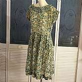 Gorgeous vintage 50s rockabilly secretary day dress in lovely green cotton voile fabric with metal side zipper. The dress has pleated neckline and full pleated skirt. Dress is handmade and could use some restitching as some of the old stitching is beginni