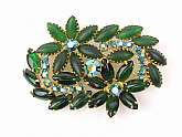 Chunky vintage Juliana rhinestone flower and leaf brooch/pin in wonderful deep emerald green with peacock aurora borealis rhinestone accents.  This is perfect for the holidays with all hand prong set rhinestones!  Pin measures 2