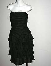 Spectacular vintage strapless layered ruffled cocktail or evening dress by A.J. Bari in fabulous black silk organza. This dress is super flattering on and the ruffles will disguise minor body bulges/flaws if need be. Tagged a size 8, it measures: bust 32,