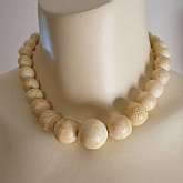 Beautiful vintage carved fossil sponge coral bead necklace with huge graduated beads that measure from 11 to 23mm. The coral has the tell tale dots or holes that you see in all fossil coral.  Necklace is 16 3/4 inches in excellent condition. Clasp is gold
