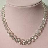 Gorgeous vintage heavy cut crystal bead necklace strung on chain with a sterling silver clasp.   It is sparkly and has beads that graduate up in size to about 1/2 inch.  The glitzy sparkle makes this choker necklace really stands out!   Measures 16 inches