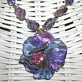 One of a kind Indie wire wrapped r, wire wrapped Amethyst gemstone beads and vintage art glass crackle beads. It is so feminine and beautiful on and much better than the photos portray.  Measures 17 inches plus 1 3/4 additional on the flower.