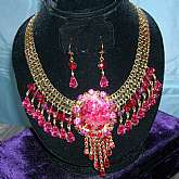 OOAK re-mixed vintage Juliana rhinestone necklace with gorgeous mottled cranberry (darker than the photos and not so pink, center stone.  All prong set stones with cranberry & red rhinestone accents and dangles.  This one of a kind creation is a combi
