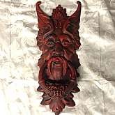 Antique heavy cast iron Fertility God (BAAL) door knocker in red. It is very large at 22” tall x 8” wide. It is in excellent condition and very goth, a bit macabre and very unusual.  Purchased at an estate auction from