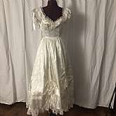 Vintage Gunne Sax cream satin wedding dress bridal gown with bows and raised areas.  This dress is to die for gorgeous and has all kinds of wonderful details and ruffles. It is very girly and looks like an old saloon girl outfit but could be used for a Vi
