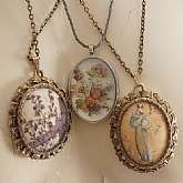 Choice of one of 4 vintage vignette cabochon pendant necklace, 2 of which have mirrors on the back side.  They are the two sugar bead coated ones in the gold tone settings.  The 3rd is a lovely floral cabochon in silver tone setting with lovely twisted ch