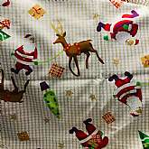 Beautiful gold metallic accented plaid cotton Christmas fabric "Tis The Season” a Joanns exclusive.  The fabric has lovely Christmas presents, Santa, reindeer, stars and heavy gold accents throughout.  There are multiple colors on a