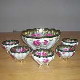 Antique Nippon moriage fine china nut bowl set with beautiful hand painted roses and heavy gold in the design.  The bowl and cups are set up on dainty curved feet and have a scalloped edge.  The hand painted designs are on both the inside and outside of t