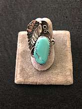 Gorgeous vintage Native American Indian extended turquoise leaf ring.   The turquoise cabochon on the spring is gorgeous and a beautiful soft turquoise color. There are swirls and an added leaf on this ring which extends down the finger. It is a size 6 an