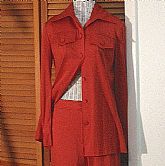 Wicked Retro Vintage 2pc Skinny Pantsuit by Lillie Rubin in a wonderful paprika colored knit poly fabric. Wonderful styling and very tailored close cut. The top is a button down with tab pockets and the straight front pants have a tab waistband and wide s