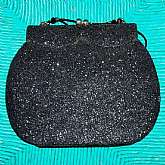 Art Deco or Art Nouveau vintage glitter shoulder bag purse in black. There is actually black glitter covering the entire bag which is really cute. It has a beaded strap with black glass bugle beads. Measures 7 1/2 by 6 inches not including strap. Perfect