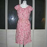 Gorgeous vintage 60s rockabilly shirtwaist day dress in a red white and pink crisp cotton.  It has a button down front, double patch pockets on the bodice, a Peter Pan collar and full darted skirt with side slash pockets plus belt.  It is in excellent vin